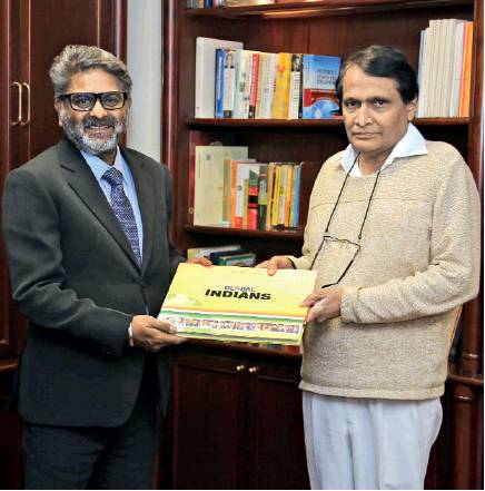 Umesh Rao presenting the Global Indians book to Suresh Prabhu Minister of Commerce and Industry